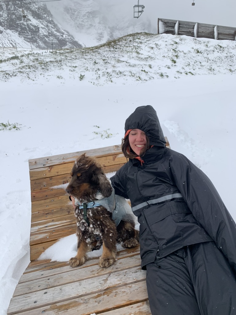My dog and me in a chair in the mountains